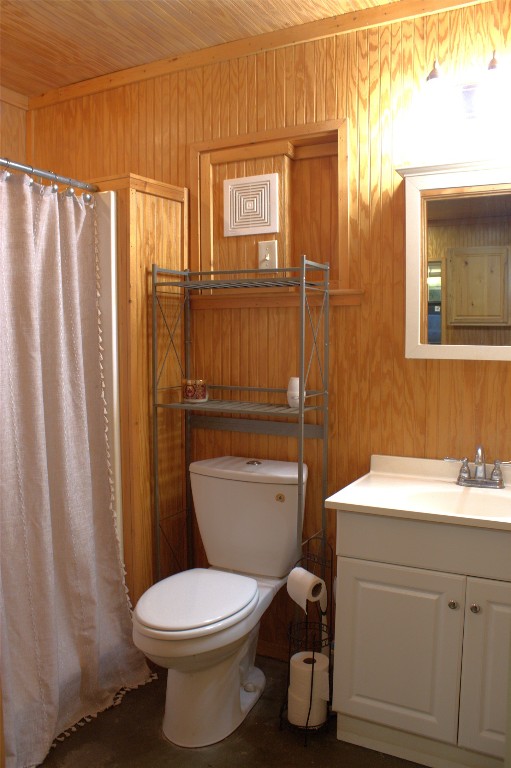 600 Jim Bowie Dr, Spicewood, TX 78669 - full bathroom featuring wooden walls, vanity, curtained shower, and wood ceiling