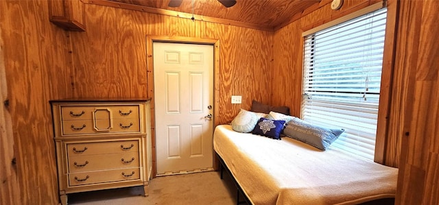 600 Jim Bowie Dr, Spicewood, TX 78669 - bedroom featuring wooden walls, wooden ceiling, and a ceiling fan