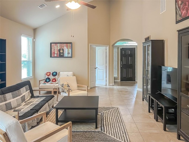 632 Schefer St, Leander, TX 78641 - living room featuring arched walkways, high vaulted ceiling, a ceiling fan, and light tile patterned flooring