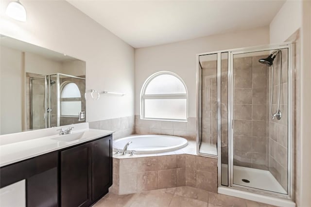 632 Schefer St, Leander, TX 78641 - full bath with a shower stall, vanity, a garden tub, and tile patterned floors