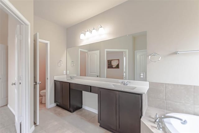 632 Schefer St, Leander, TX 78641 - bathroom featuring double vanity, tile patterned floors, and a tub