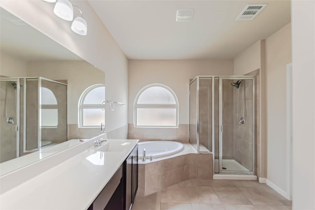 632 Schefer St, Leander, TX 78641 - full bathroom with a garden tub, vanity, a stall shower, and tile patterned flooring