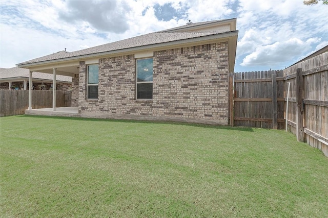 632 Schefer St, Leander, TX 78641 - back of property with brick siding and a patio area