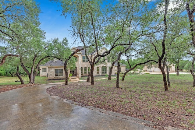1130 Whispering Water, Spring Branch, TX 78070 - view of front of property featuring stone siding and a front yard