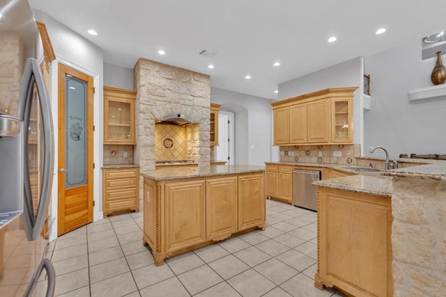 1130 Whispering Water, Spring Branch, TX 78070 - kitchen featuring stainless steel appliances, backsplash, light tile patterned flooring, light brown cabinets, and recessed lighting
