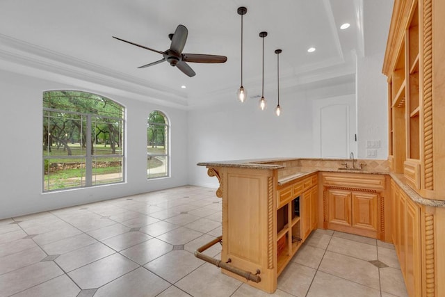 1130 Whispering Water, Spring Branch, TX 78070 - kitchen with a raised ceiling, light stone countertops, a peninsula, recessed lighting, and a ceiling fan