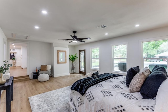 606 Lilac Dr, Round Rock, TX 78664 - bedroom featuring light wood finished floors, recessed lighting, attic access, and a ceiling fan
