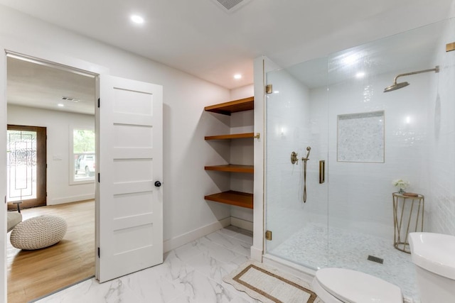 606 Lilac Dr, Round Rock, TX 78664 - bathroom featuring a shower stall, marble look tile flooring, and recessed lighting