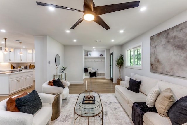 606 Lilac Dr, Round Rock, TX 78664 - living room with recessed lighting, light wood finished floors, and a ceiling fan