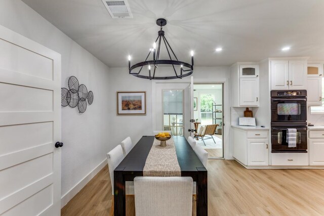 606 Lilac Dr, Round Rock, TX 78664 - dining area featuring a chandelier, light wood-type flooring, and recessed lighting