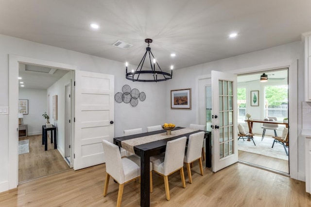606 Lilac Dr, Round Rock, TX 78664 - dining space with light wood-style flooring, french doors, recessed lighting, and a chandelier