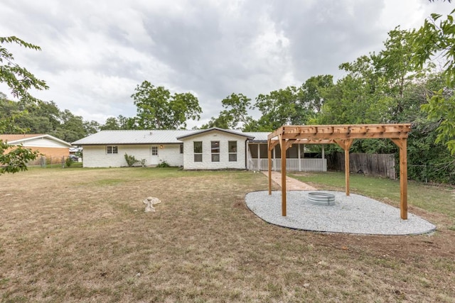 606 Lilac Dr, Round Rock, TX 78664 - back of house with a pergola, a patio, a fenced backyard, and a metal roof
