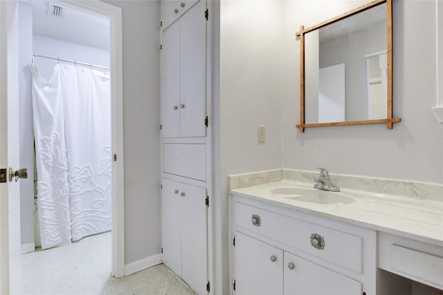 400 N Brazos St, Granger, TX 76530 - bathroom with vanity and baseboards