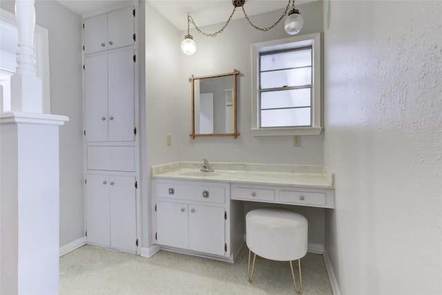 400 N Brazos St, Granger, TX 76530 - bathroom featuring baseboards and vanity