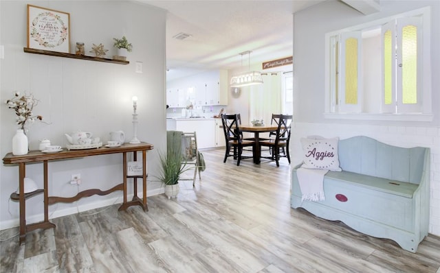 400 N Brazos St, Granger, TX 76530 - corridor featuring light wood-style floors and baseboards