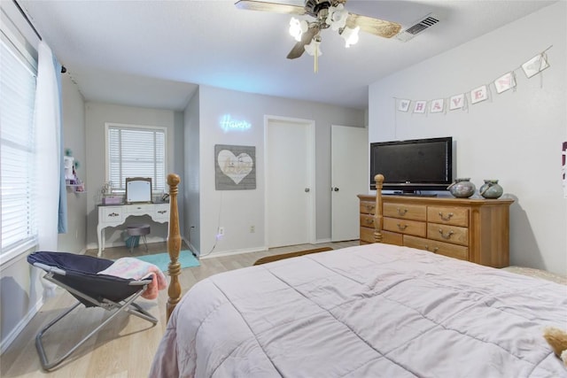 400 N Brazos St, Granger, TX 76530 - bedroom featuring wood finished floors and a ceiling fan