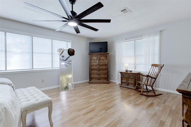 400 N Brazos St, Granger, TX 76530 - living area with light wood finished floors and ceiling fan