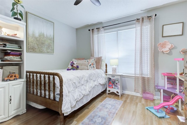 400 N Brazos St, Granger, TX 76530 - bedroom featuring wood finished floors and ceiling fan