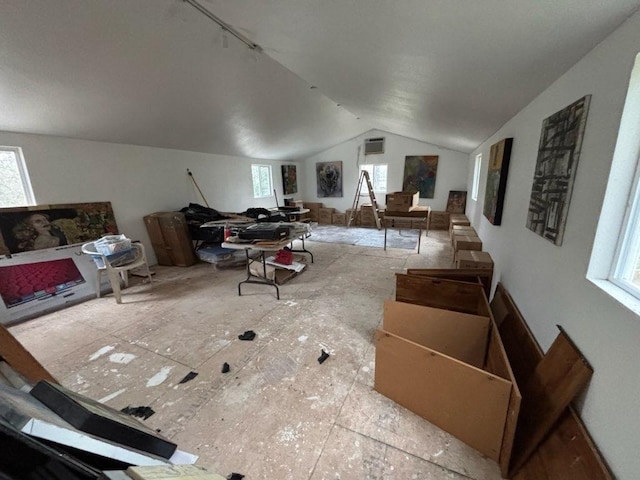 368 Riddle Rd, Cedar Creek, TX 78612 - living room with plenty of natural light, lofted ceiling, and a wall mounted AC