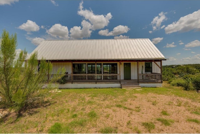 25633 Pedernales Point Dr, Spicewood, TX 78669 - view of front of home with a porch and a metal roof