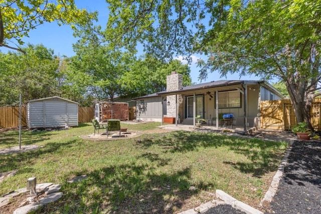 901 Pack Saddle Pass, Round Rock, TX 78681 - rear view of house featuring a chimney, a storage unit, a patio area, and a fenced backyard