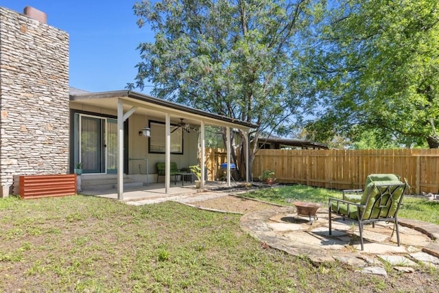 901 Pack Saddle Pass, Round Rock, TX 78681 - fenced backyard with an outdoor fire pit, ceiling fan, and a patio