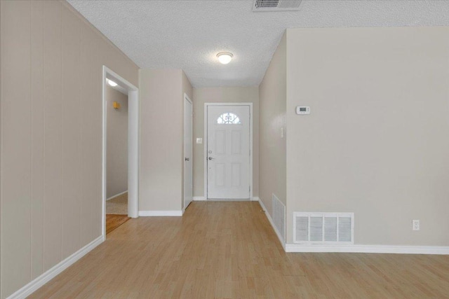 901 Pack Saddle Pass, Round Rock, TX 78681 - foyer entrance with light wood-style flooring and a textured ceiling
