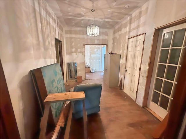 321 Douglas St, Lexington, TX 78947 - corridor featuring a chandelier