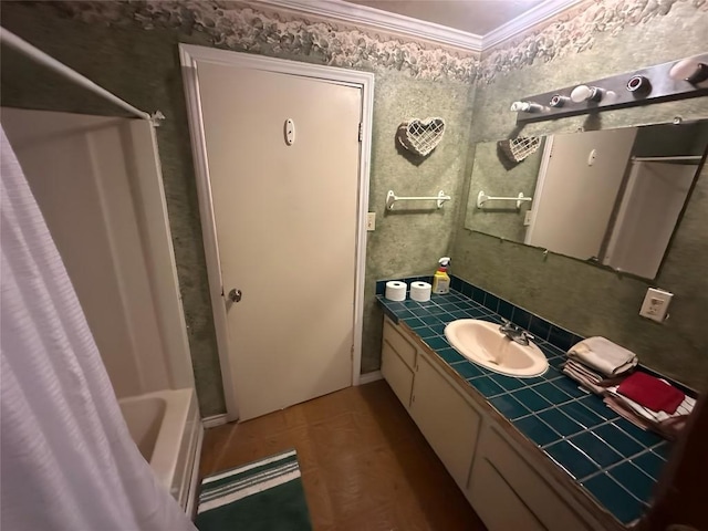 321 Douglas St, Lexington, TX 78947 - full bath featuring vanity, crown molding, and shower / tub combo