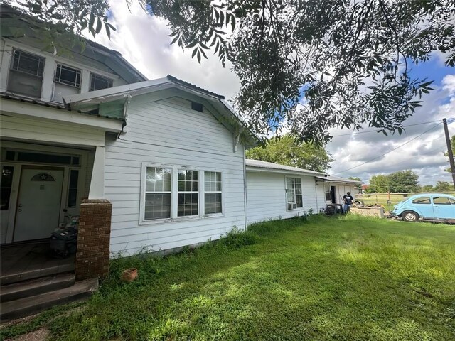 321 Douglas St, Lexington, TX 78947 - view of home's exterior with a yard