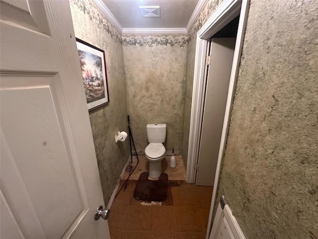 321 Douglas St, Lexington, TX 78947 - bathroom with toilet and ornamental molding