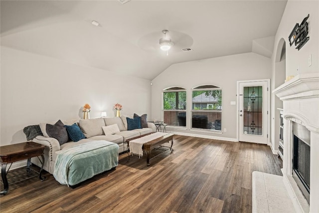 3792 Turetella Dr, Round Rock, TX 78681 - living area featuring vaulted ceiling, a fireplace, a ceiling fan, and wood finished floors