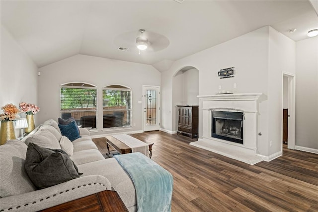 3792 Turetella Dr, Round Rock, TX 78681 - living room featuring ceiling fan, a fireplace with raised hearth, dark wood-style floors, and lofted ceiling