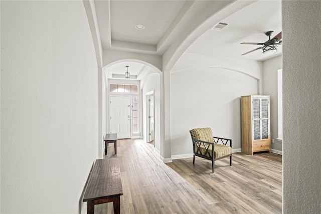 3792 Turetella Dr, Round Rock, TX 78681 - hall with arched walkways and wood finished floors