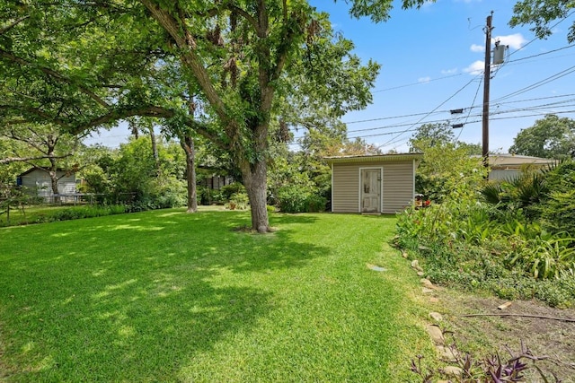 1314 Cloverleaf Dr, Austin, TX 78723 - view of yard with an outdoor structure
