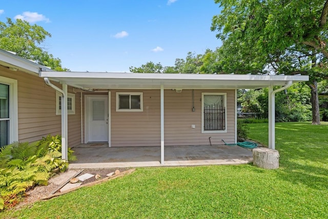 1314 Cloverleaf Dr, Austin, TX 78723 - rear view of property with a lawn and a patio