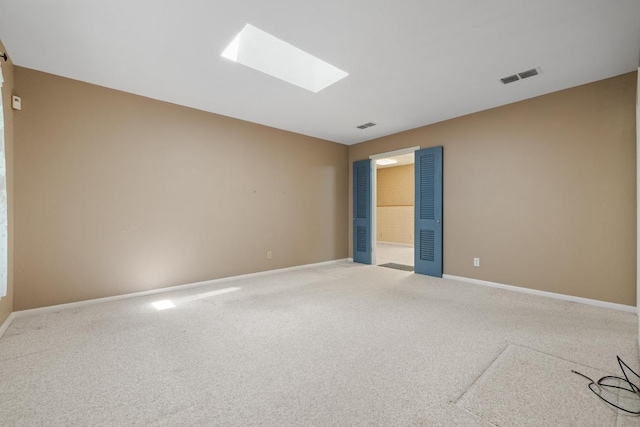1314 Cloverleaf Dr, Austin, TX 78723 - carpeted empty room with a skylight and baseboards