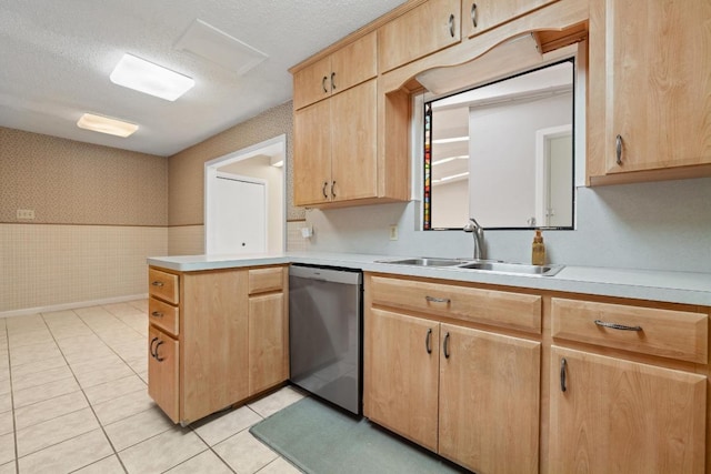 1314 Cloverleaf Dr, Austin, TX 78723 - kitchen featuring stainless steel dishwasher, wallpapered walls, light brown cabinets, light countertops, and a textured ceiling