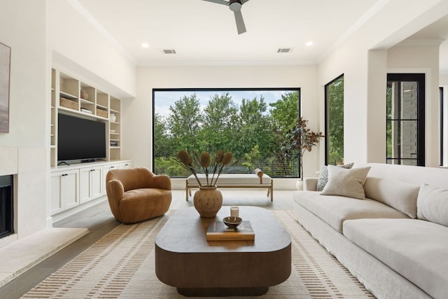 12309 Carlsbad Dr, Austin, TX 78738 - living area featuring crown molding, built in features, a high end fireplace, recessed lighting, and a ceiling fan