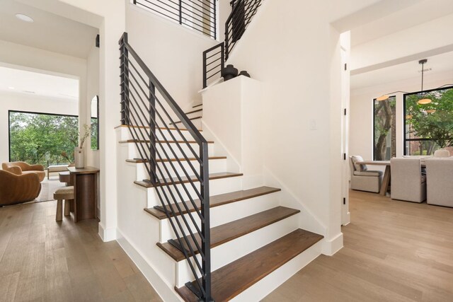 12309 Carlsbad Dr, Austin, TX 78738 - stairs featuring wood finished floors and recessed lighting