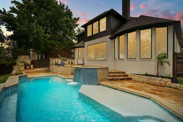 12309 Carlsbad Dr, Austin, TX 78738 - rear view of house featuring a patio area, a chimney, an outdoor pool, and roof with shingles
