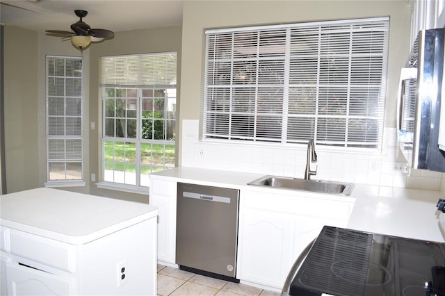 30007 Oakland Hills Dr, Georgetown, TX 78628 - kitchen with dishwasher, a ceiling fan, white cabinets, range, and light countertops