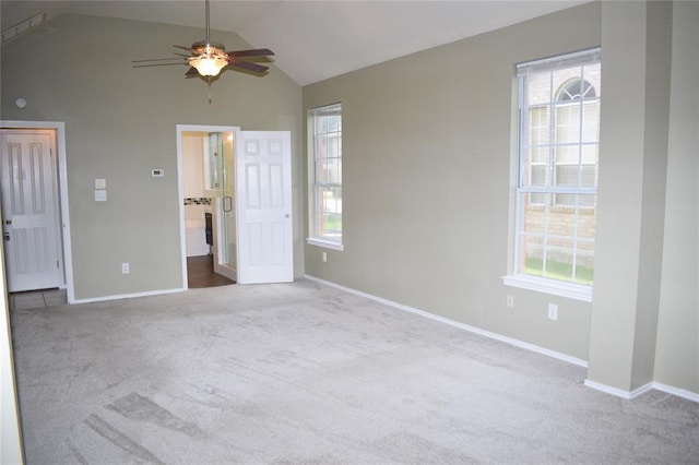 30007 Oakland Hills Dr, Georgetown, TX 78628 - unfurnished bedroom with carpet flooring, multiple windows, lofted ceiling, and ensuite bath