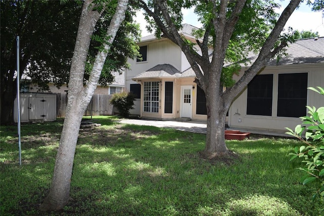30007 Oakland Hills Dr, Georgetown, TX 78628 - rear view of property featuring roof with shingles and a patio area