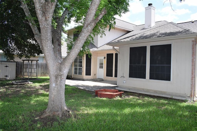30007 Oakland Hills Dr, Georgetown, TX 78628 - back of house featuring a shingled roof, a chimney, and a patio