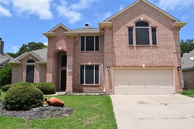 30007 Oakland Hills Dr, Georgetown, TX 78628 - traditional-style home featuring brick siding, driveway, an attached garage, and a front lawn