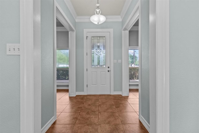 1205 Mountain View Dr, San Marcos, TX 78666 - entrance foyer with healthy amount of natural light, dark tile patterned floors, and crown molding