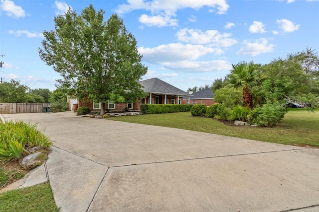 1205 Mountain View Dr, San Marcos, TX 78666 - view of front facade with concrete driveway and brick siding