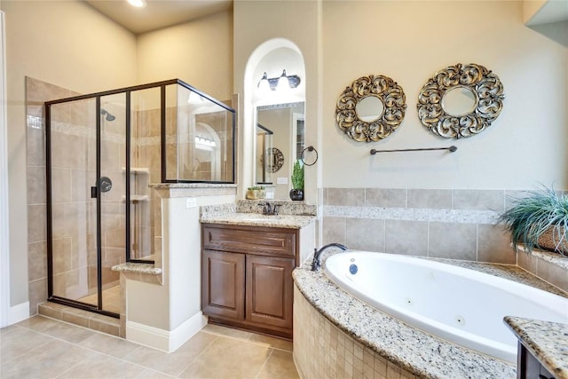 4108 Charbray Ct, Cedar Park, TX 78613 - bathroom featuring a stall shower, a tub with jets, vanity, and tile patterned floors