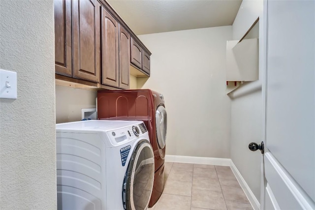 4108 Charbray Ct, Cedar Park, TX 78613 - laundry area featuring independent washer and dryer, cabinet space, and light tile patterned floors
